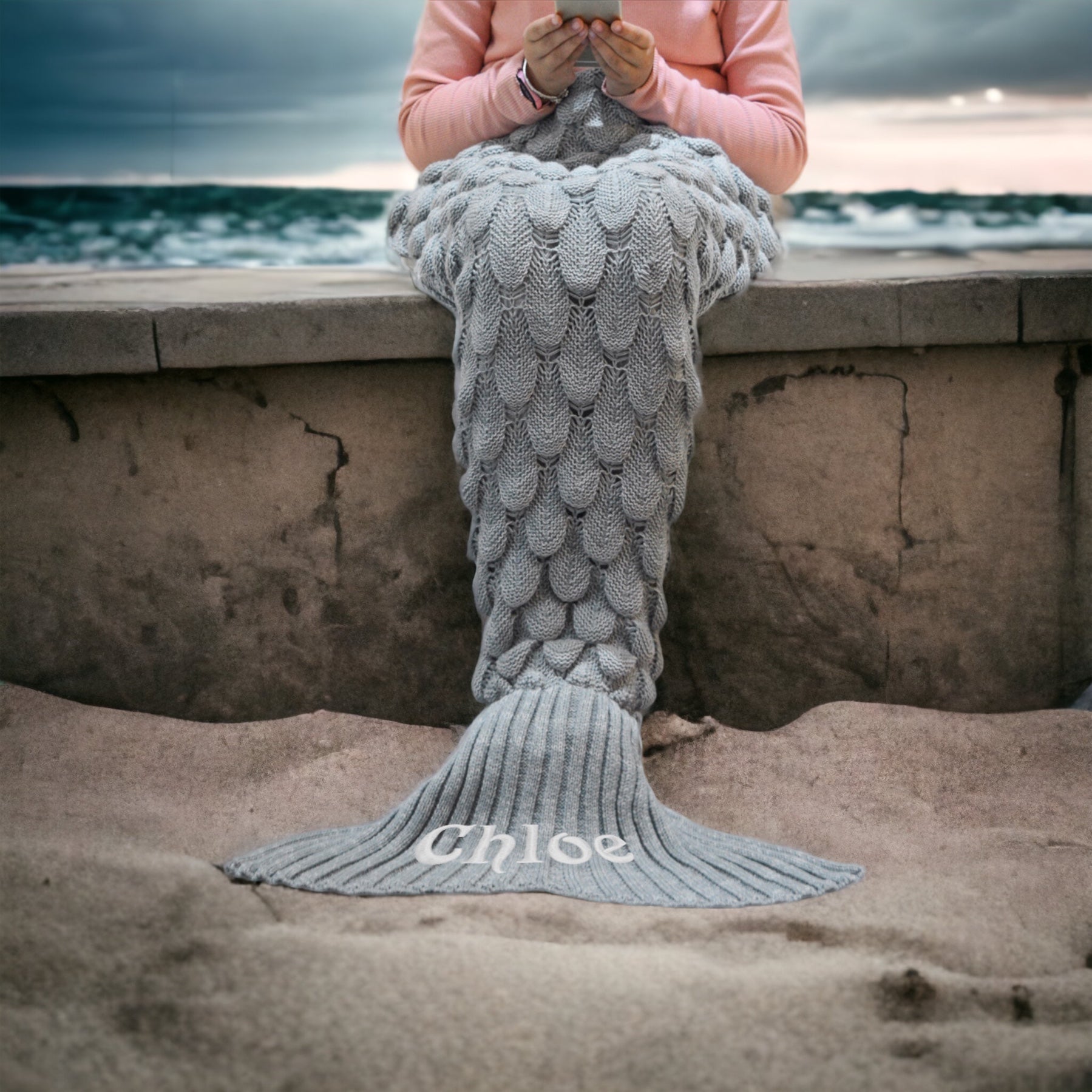 "Mermaid Tail Blanket - Magical Aqua" Description: "A magical aqua-colored mermaid tail blanket designed for ultimate comfort, with an option to personalize it with a name."